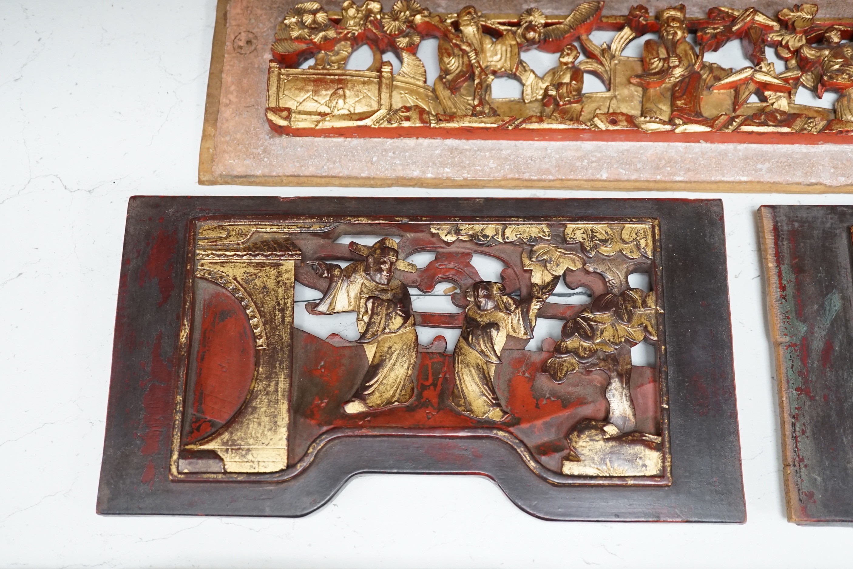 Two South East Asian carved hardwood panels together with three Chinese gilt wood panels (5) largest 6x91cm